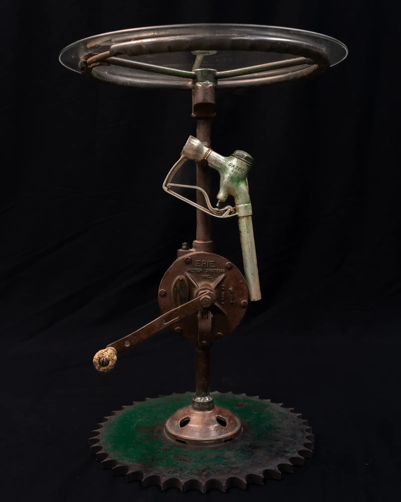 Pump Table, Reclaimed transfer pump, tractor gear, tractor steering wheel, fuel handle, glass top