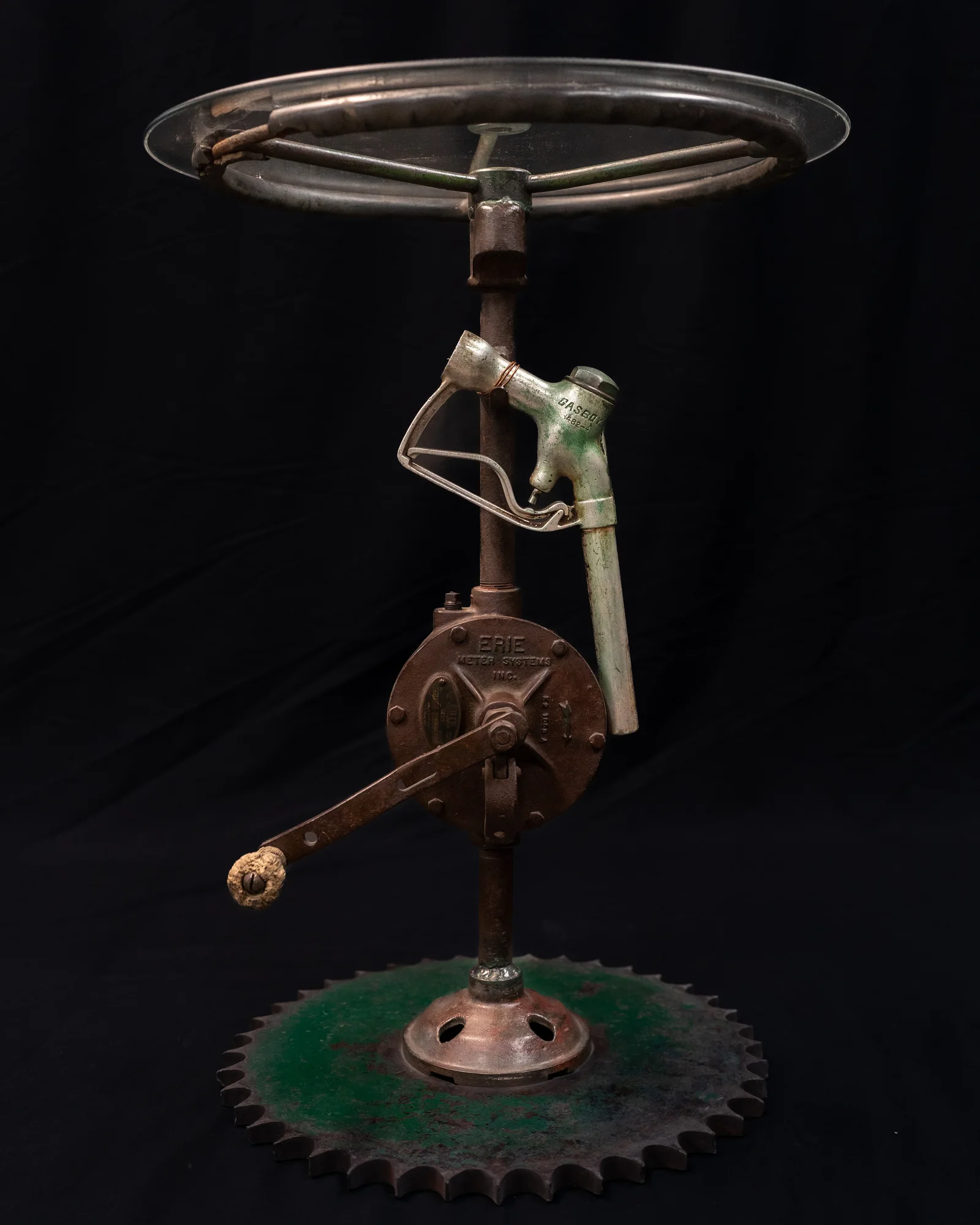 Pump Table, Reclaimed transfer pump, tractor gear, tractor steering wheel, fuel handle, glass top