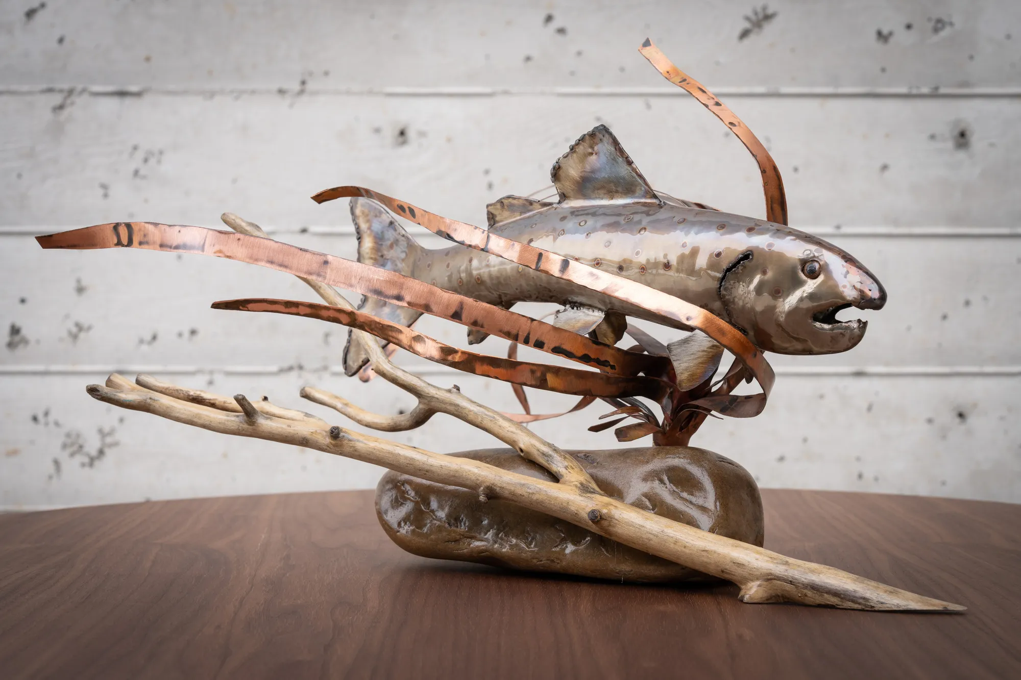 Feeling the Flow, Reclaimed stainless steel (heat colored), river rock base, reclaimed copper grass